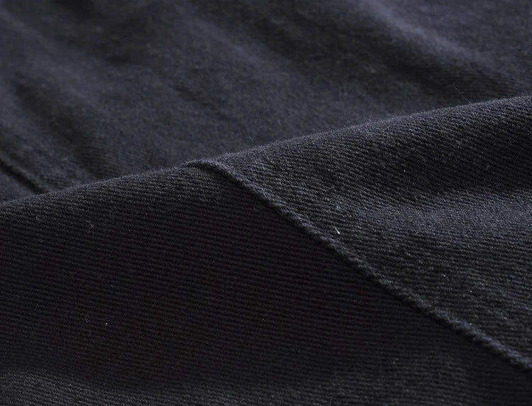 Veste en jean noir avec trou à rivets
